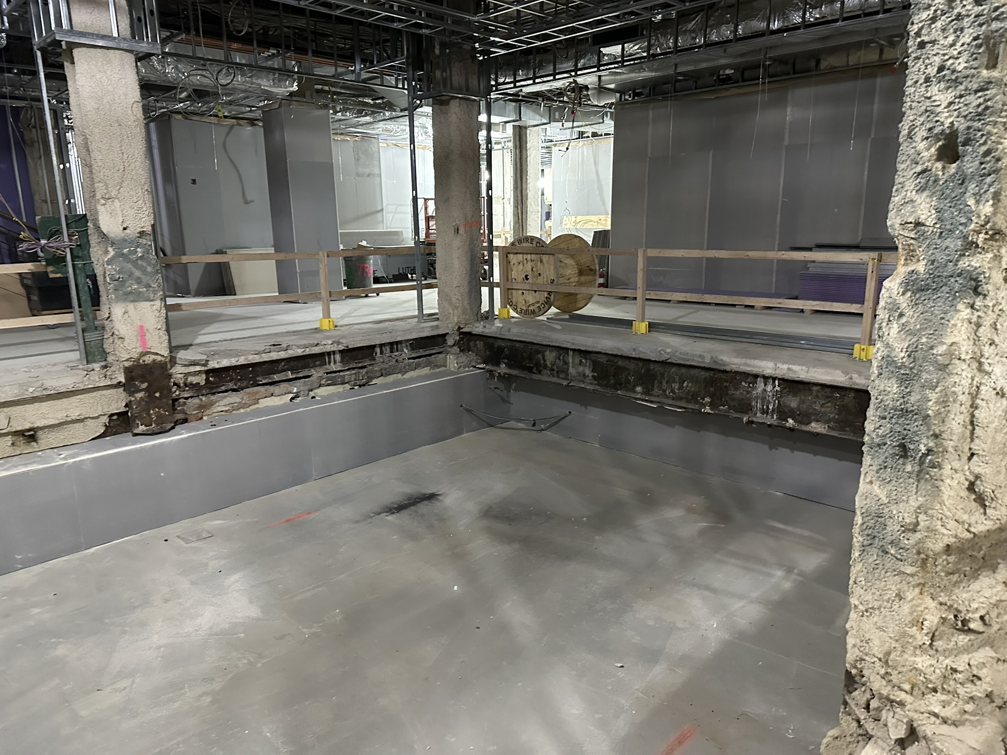 Secondary containment slab area for pool/spa with waterproofing/containment liner installed at Bellevue Bathhouse.