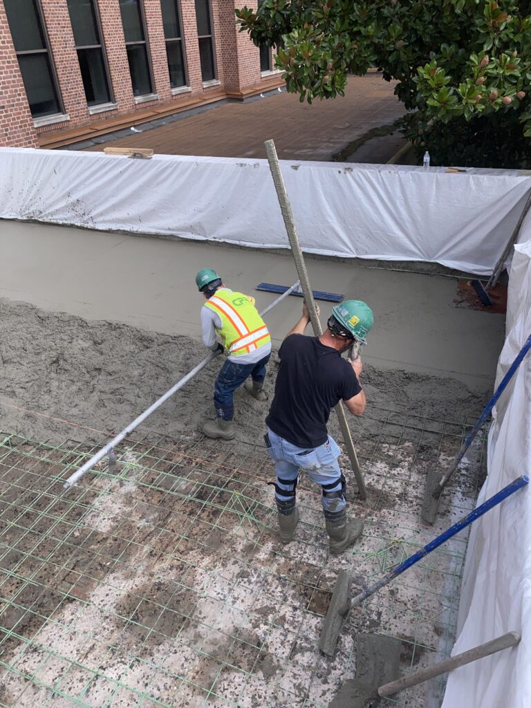 Terrace demolition at McAuley Hall Johns Hopkins Mt Washington Campus Baltimore MD exposing structural clay tile slab.